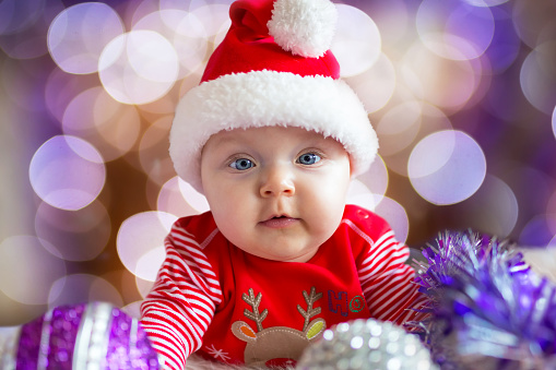 Portrait of baby girl in santa costume for Christmas