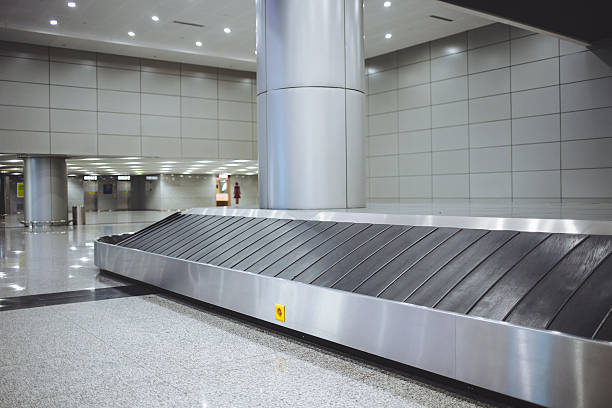 istock Baggage conveyor belt in the airport 499390246