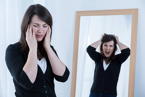 istock Woman trying to mask emotions 499391940