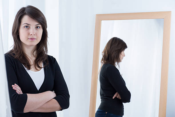 istock Woman standing with crossed arms 499393052