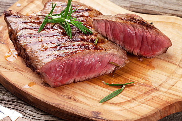istock Grilled beef steak with rosemary, salt and pepper 499396478