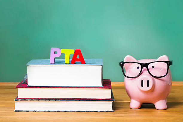 istock PTA theme with pink piggy bank with chalkboard 499397702