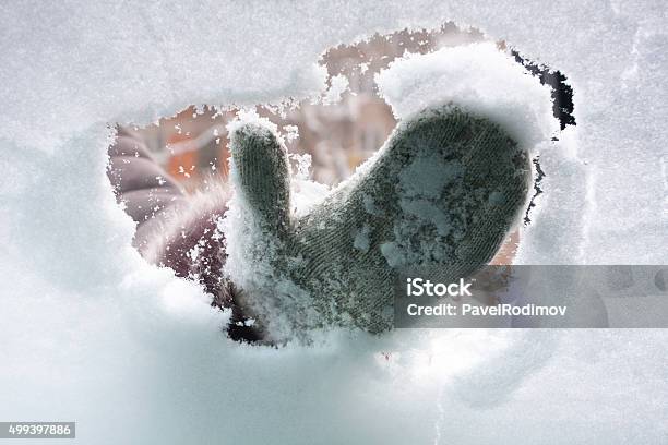 Hand In Mitten Cleaning Window Of Car Stock Photo - Download Image Now - Snow, Car, Mitten - Glove
