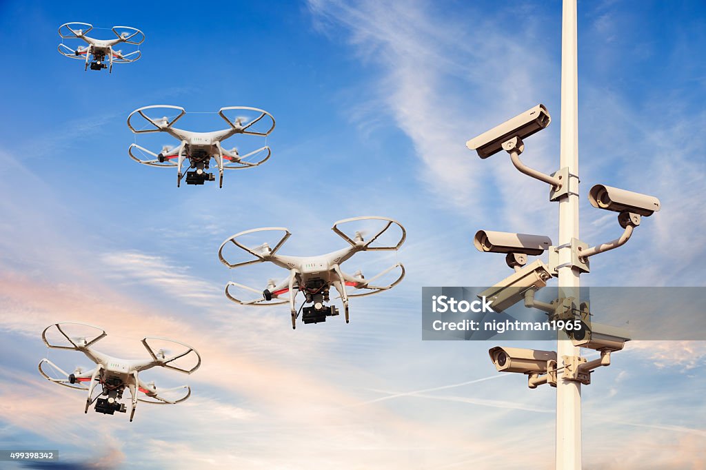 Protected area Many drones flying against the blue sky. Drone Stock Photo