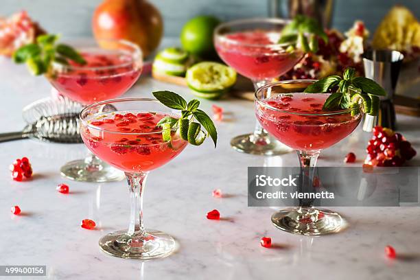 Pomegranate Basil Martinis Or Gin Smash Cocktails Stock Photo - Download Image Now - Pomegranate, Martini, Alcohol - Drink