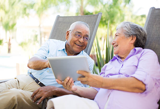 istock Loving senior couple with a tablet 499400549