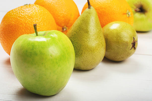 istock Ripe green apple, oranges with pears 499401026