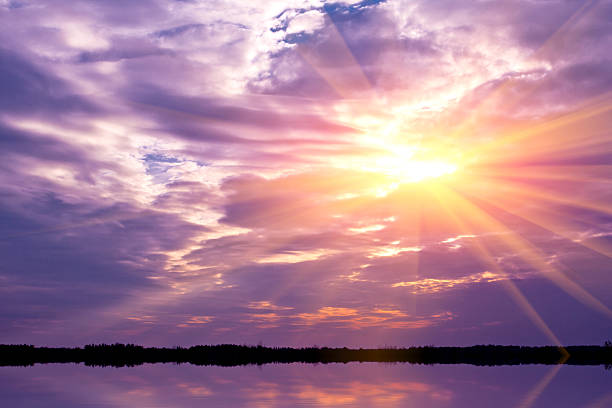 istock sunset in dark clouds over lake 499401289
