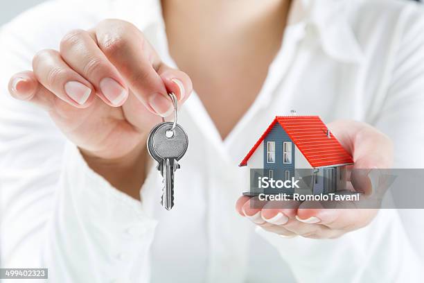 Delivery Keys To House Stock Photo - Download Image Now - Key, Giving, Residential Building