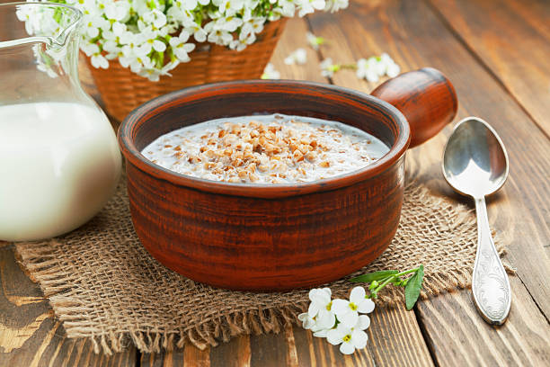 Buckwheat porridge with milk stock photo