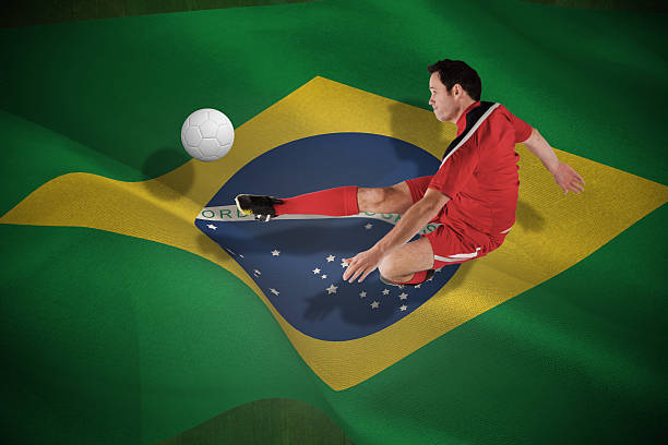 istock Football player in red kicking 499402927