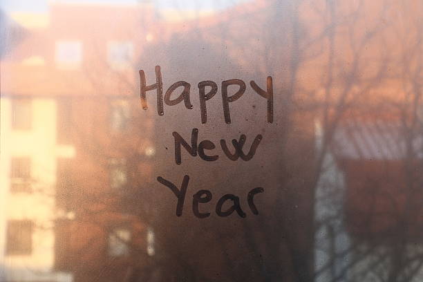 istock Happy New Year text written on the glass 499402960