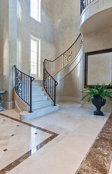 istock Beautiful Entryway with Custom Wrought Iron Staircase and Venetian Plaster 499403256