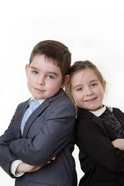 istock young kid dressed up as a business person 499404907