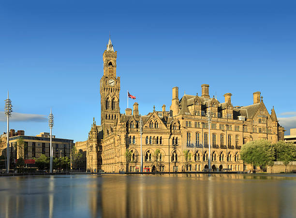 istock Bradford City Hall reflected in the mirror pool in Centenary Square. 499407845