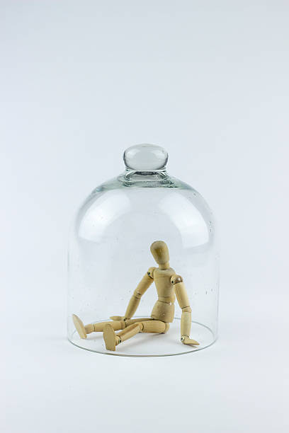 istock Wooden puppet in a glass bell 499418408