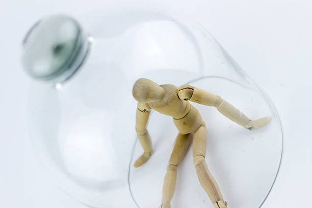 istock Wooden puppet in a glass bell 499418454