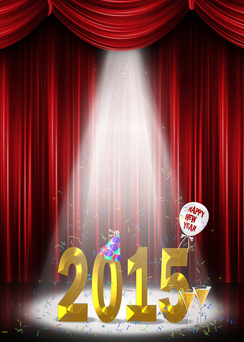 New year for 2015 celebration in the spotlight on stage with party confetti.