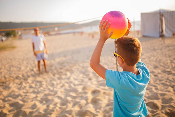 istock Family volleyball on beach 499421124