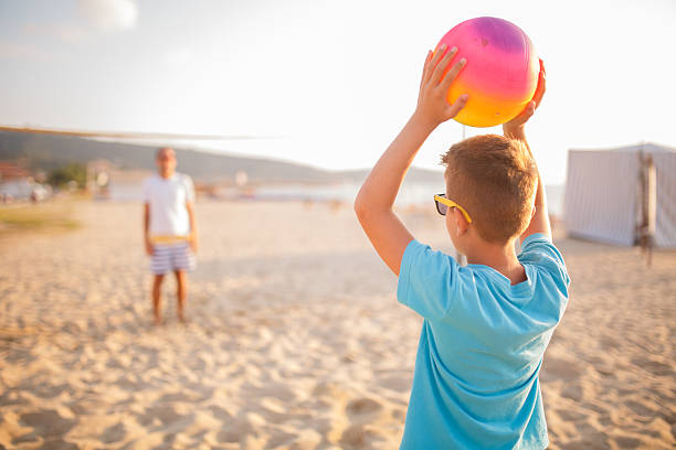 istock Family volleyball on beach 499421308