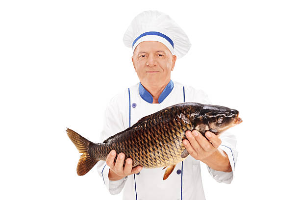 istock Mature chef holding a fresh chub 499421651