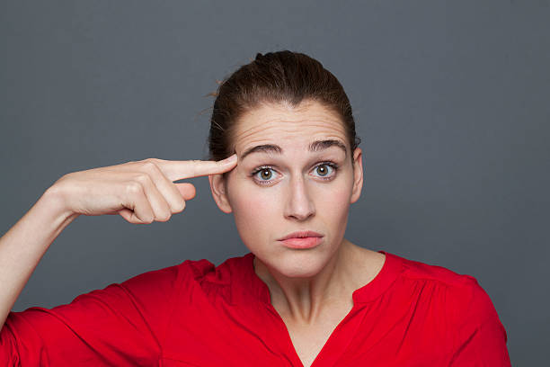 istock stunned young woman expressing mind confusion with crazy hand gesture 499421710