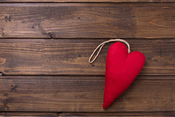 istock Heart on wooden background 499422298