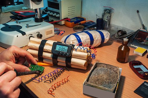 explosives (timebomb) maker in workshop