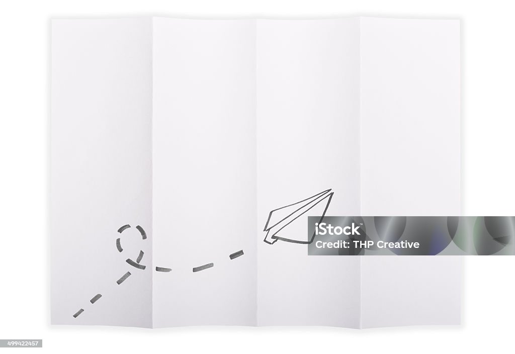 Paper Aeroplanes White paper sheet folded in 4 quarters isolated over a white background with a paper aeroplane sketched on it Folded Stock Photo