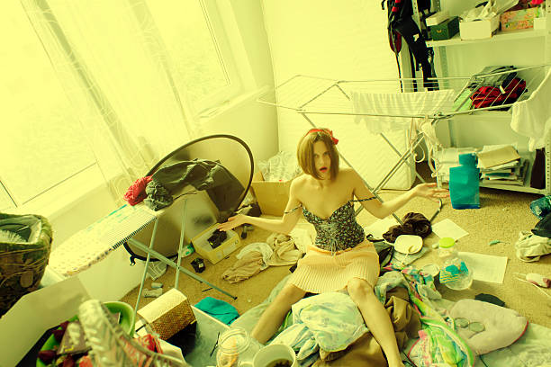 istock beautiful woman is expressing panic in her really messy room 499424239