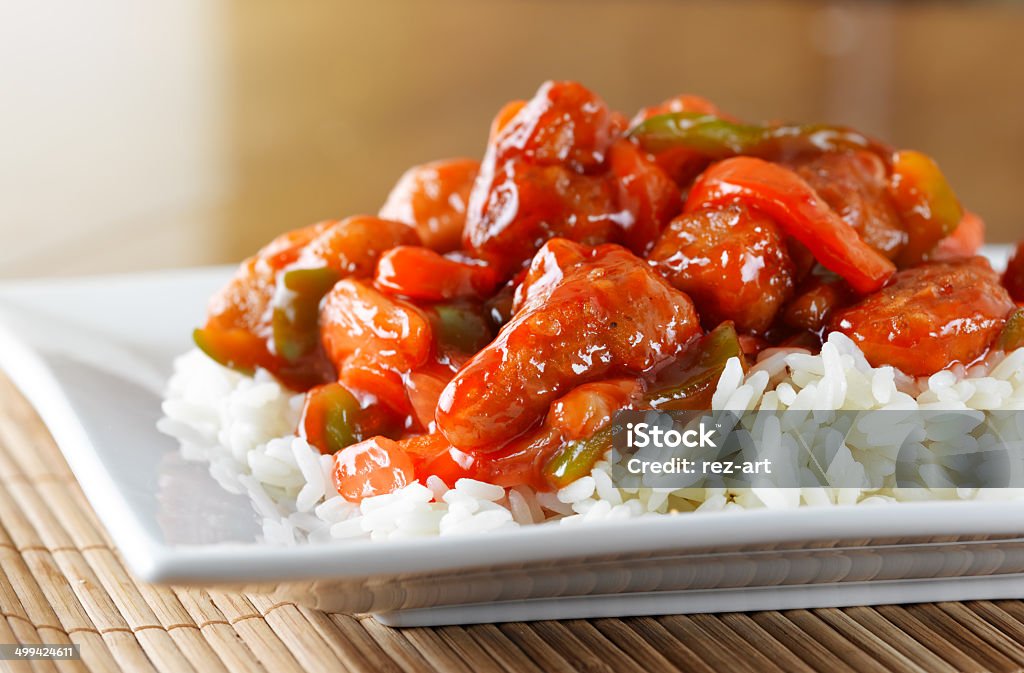 sweet and sour chicken on rice sweet and sour chicken on rice, shot up close Chinese Food Stock Photo