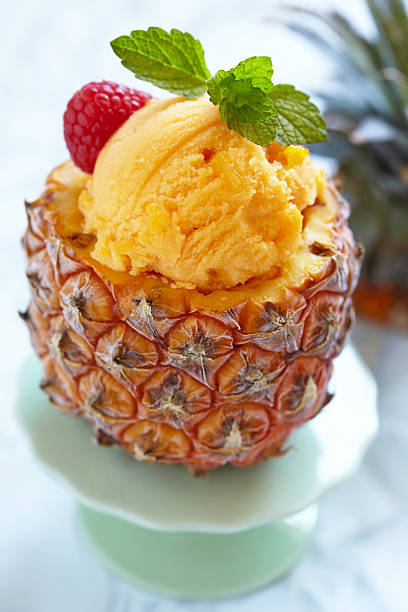 istock Fruit sorbet ice cream in small pineapple 499426181