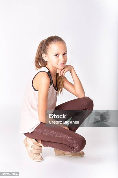 Cute Girl Posing On A White Background Stock Photo - Download Image Now - 2015, Arts Culture and Entertainment, Beautiful People
