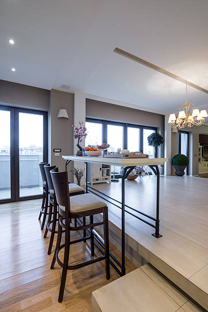 istock Interior of a modern apartment with bar table and chairs 499428238