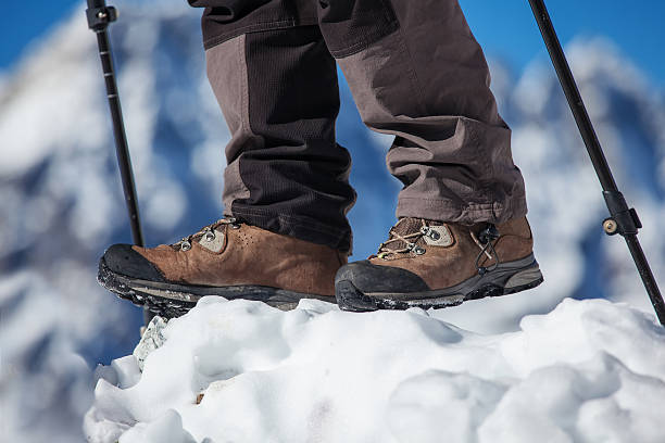 istock Hiking boot closeup on mountain rocks 499429576