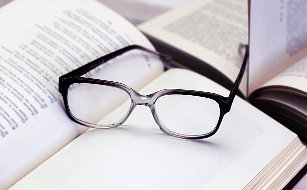 istock glasses and open books on the table 499432473