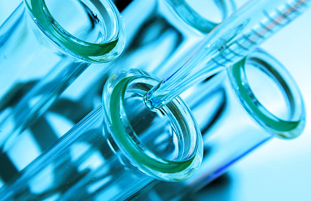 istock pipette and test tube on blue background 499433757