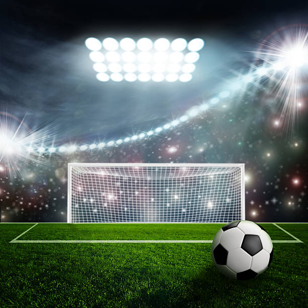 istock Soccer ball on green stadium arena 499434615