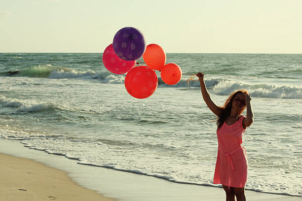 istock beautiful woman on seaside 499434747