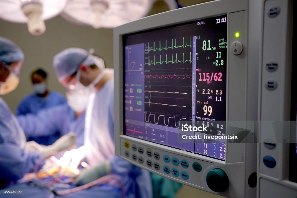 heart monitor in a hospital heart rate monitor and doctors in an emergency room Emergency Room Stock Photo