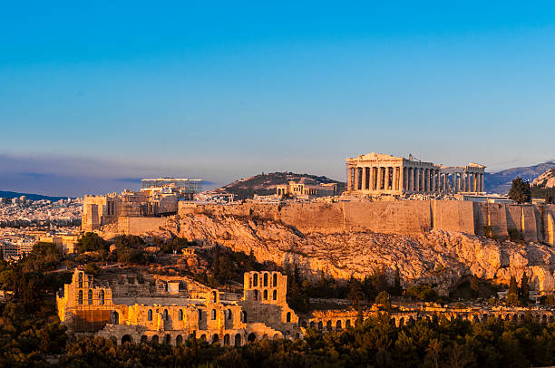 acropolis hill, parthenon, athens, greece. odeon herodes atticus. golden twilight. - athens stockfoto's en -beelden