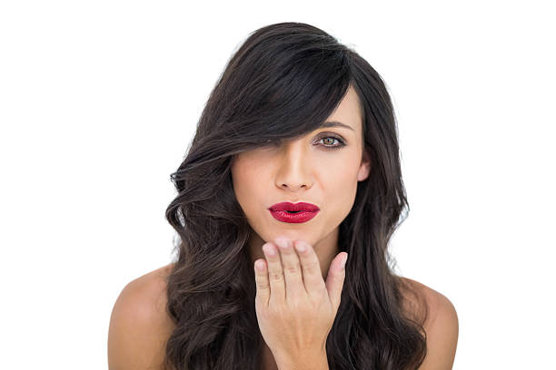istock Sexy brunette blowing kiss to camera 499435695