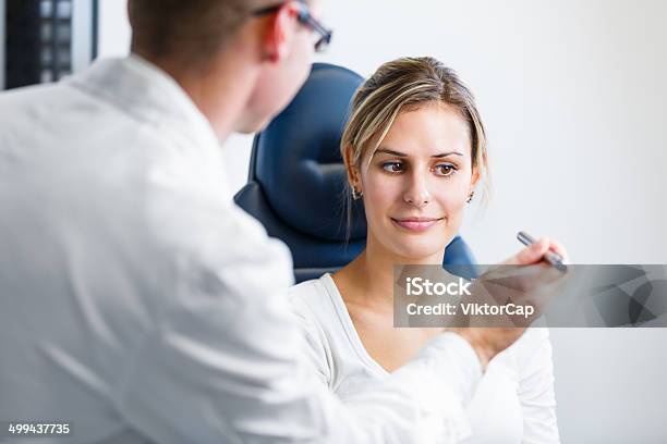 Pretty Young Woman Having Her Eyes Examined By Optometrics Stock Photo - Download Image Now