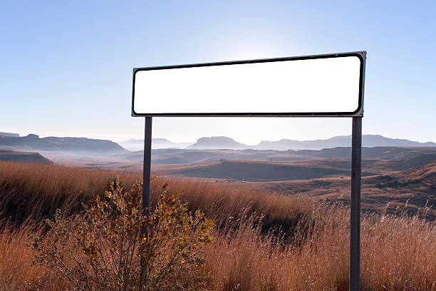 istock Dry Winter Rural Landscape with Blank Sign in Foreground 499438031