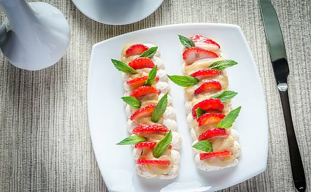 istock Meringue cake with cream and fresh strawberries 499448223