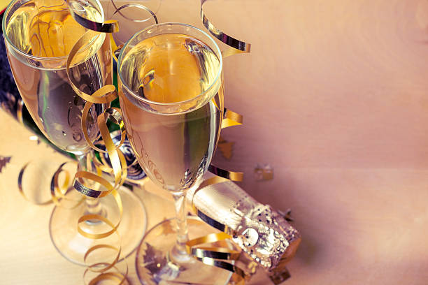 Flutes of champagne in holiday setting stock photo