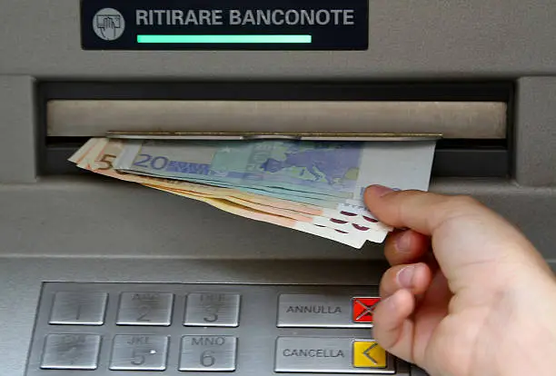 Photo of Withdraw money in banknotes from an ATM