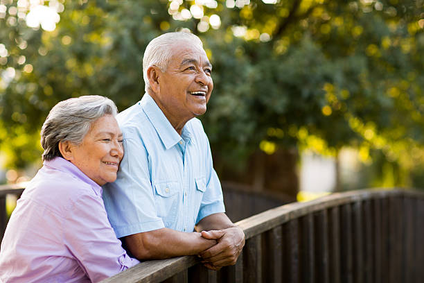 istock Senior couple enjoy afternoon on bridge 499449329