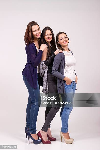 Portrait Of Three Girls In High Heel Shoes Stock Photo - Download Image Now - Short Person, Tall Person, 2015