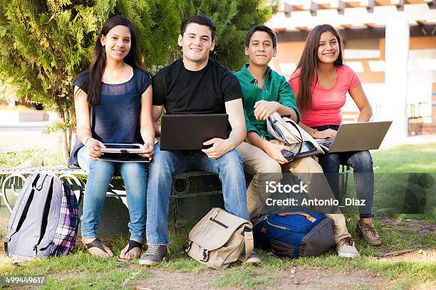 Happy Students Using Technolgy Stock Photo - Download Image Now - 14-15 Years, Adolescence, Back to School